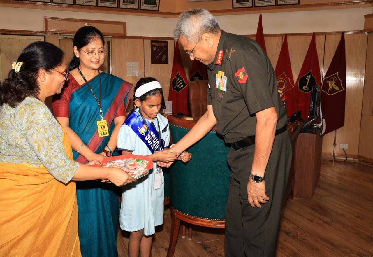A Scholars' Home student tying a rakhi on the wrist of Lieutenant General Anindya Sengupta at Central Command, Lucknow