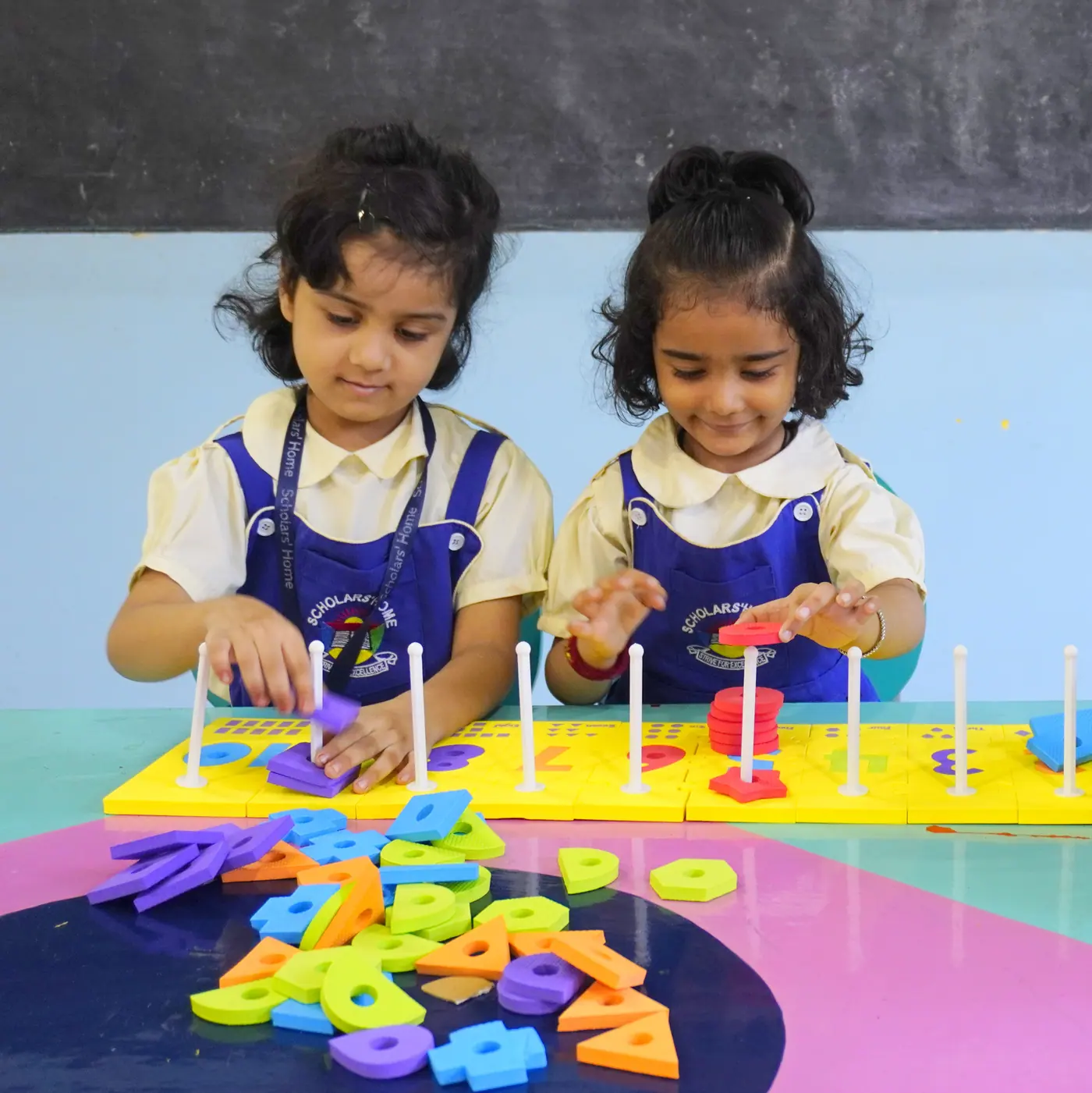 Pre-Primary children learning with stacking toys