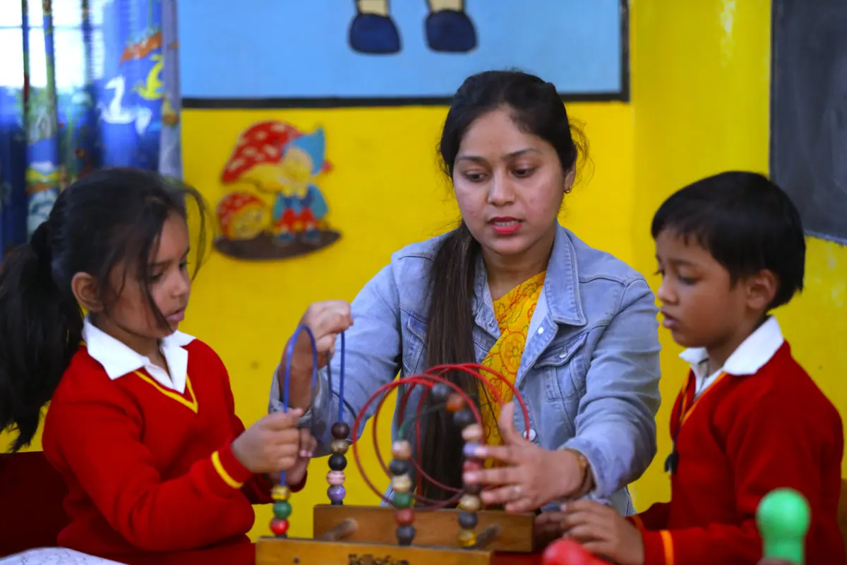 A Pre-Primary teacher with children at Scholars' Home nursery school, Gomti Nagar, Lucknow